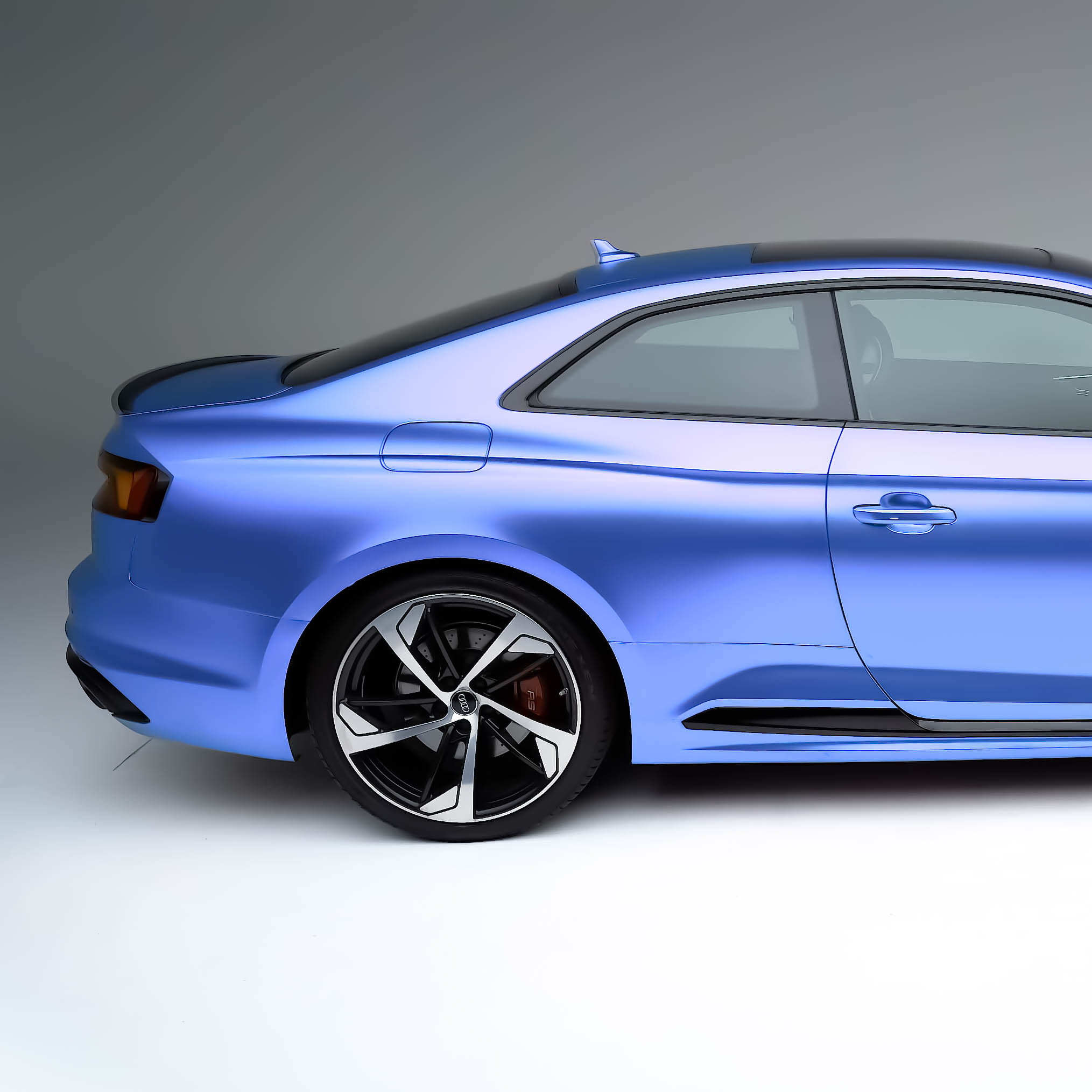 Stratum 50% automotive window tint side view on a blue Audi coupe